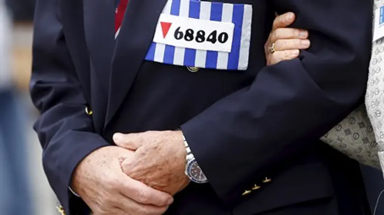 Mauthausen visitor wears prisn number