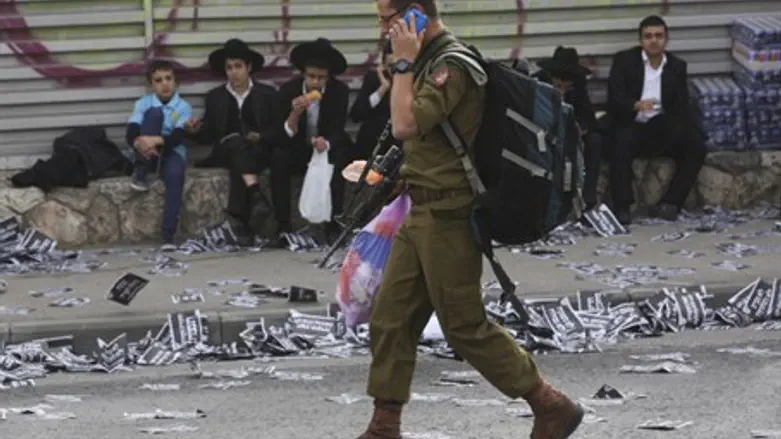 Soldier walks through haredi neighborhood
