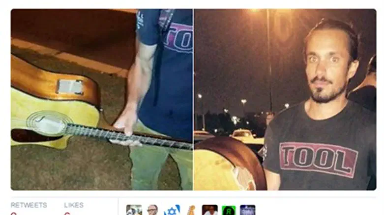 Yishai Montgomery with his guitar