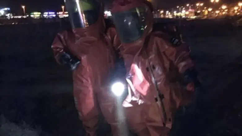 Hazardous materials inspectors at site of train collision