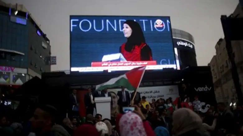 Crowd watches Hroub's winning ceremony in Ramallah
