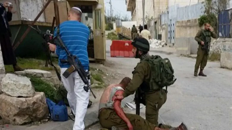 Site of Thursday's attack in Hevron, Arab films at screen left