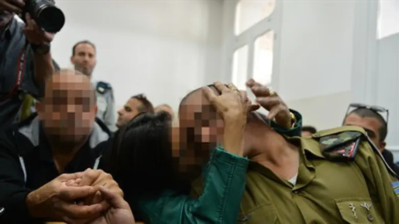 Hevron soldier with his parents in court