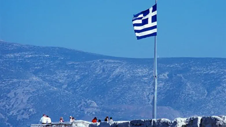 Flag of Greece flies atop Athens parliament building