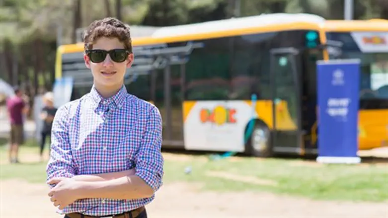 Noah Helfstein in front of the 'Maker Bus'