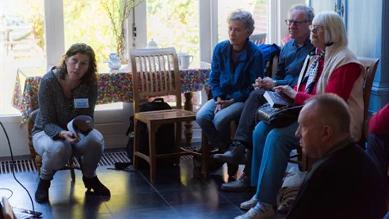 Yvonne van Gennep-Bouma, left, telling visitors about Jewish family that lived at her home