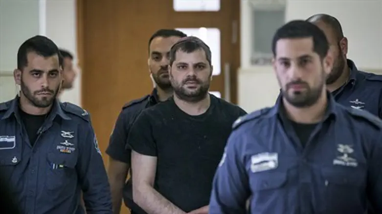 Yosef Haim Ben-David arrives for sentencing hearing at Jerusalem District Court