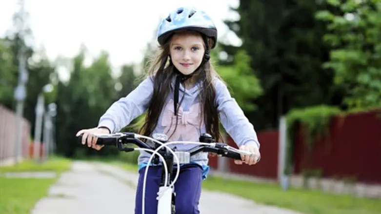 Girl on bicycle (illustrative)