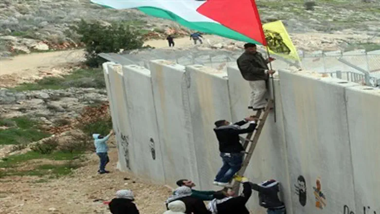 Arabs scale security barrier