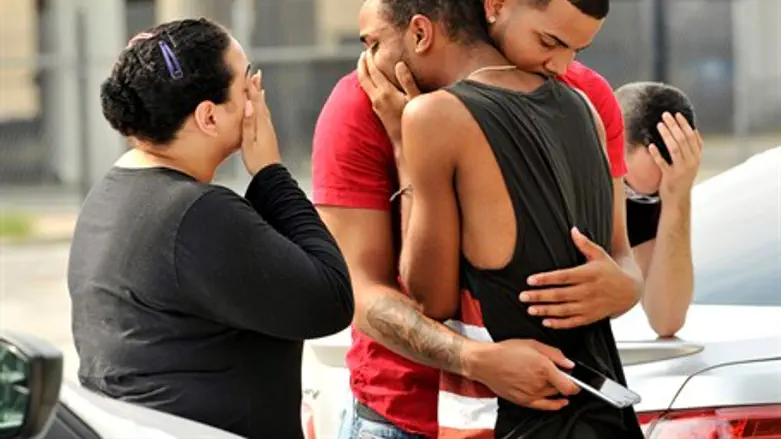 Friends and family of victims of Orlando gayclub shooting react outside police station