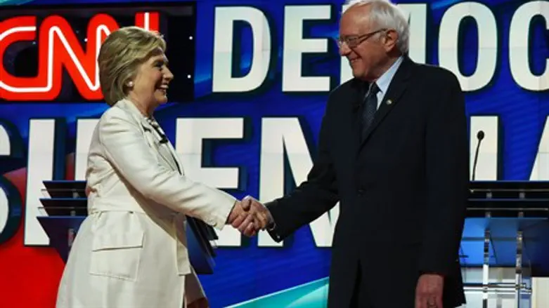 Clinton and Sanders greeting each other at presidential debate in Brooklyn