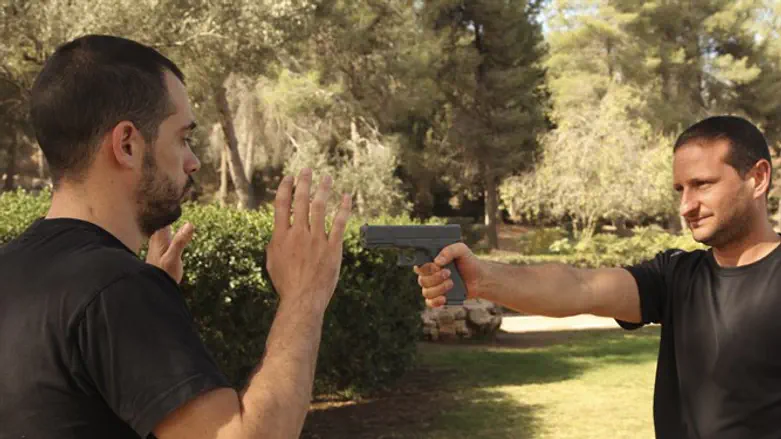 Man threatening with gun (stock photo)
