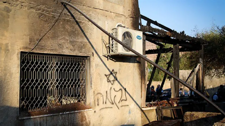 Graffiti at Duma arson site