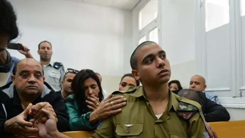 Elor Azariya in court with his parents