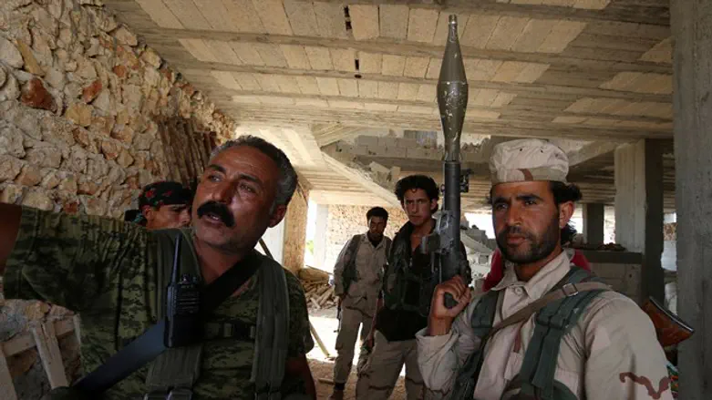 Syrian Democratic Forces fighters outside Manbij