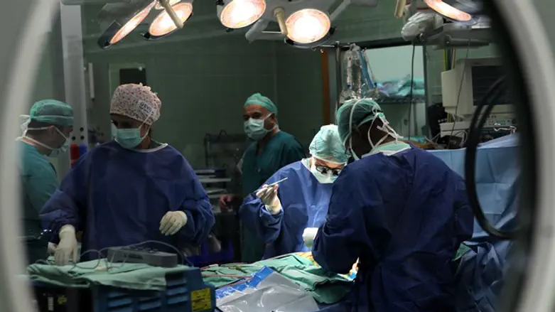 Doctors perform surgery