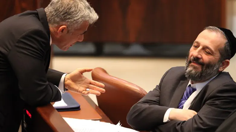 Yair Lapid (Left, Yesh Atid) with Aryeh Deri (Right, Shas)