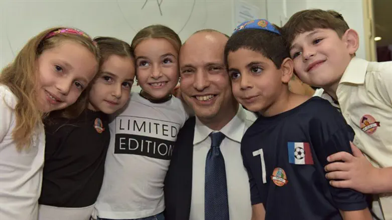 Bennett greets children on first day of school