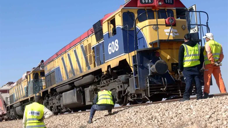 Israel Railways workers with train