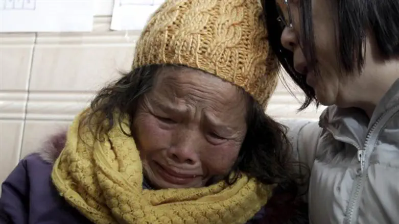 קרובת משפחה של נפגעי הרעש בטאינאן