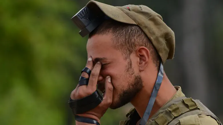 IDF soldier prays near Gaza
