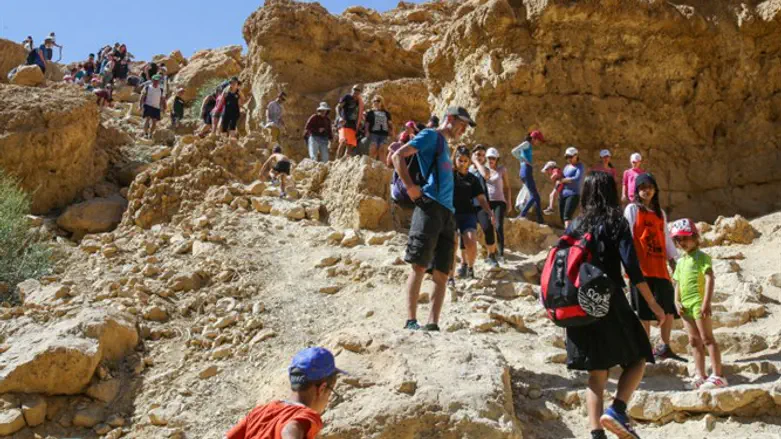 Hikers by stream near Dead Sea
