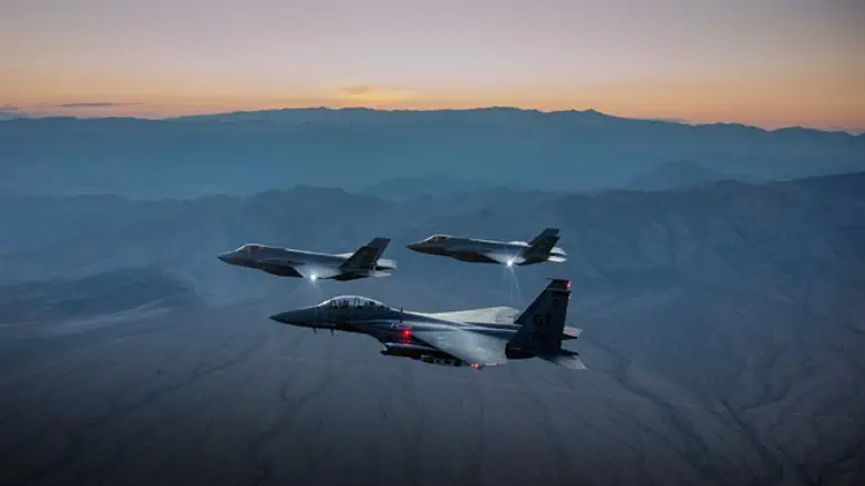 F-35A Lightning II Joint Strike Fighter leads formation of other fighter jets.