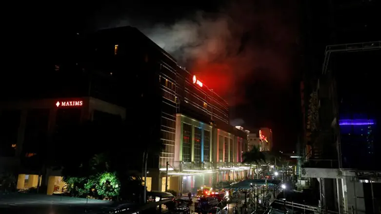 smoke rises from Manila World resort building