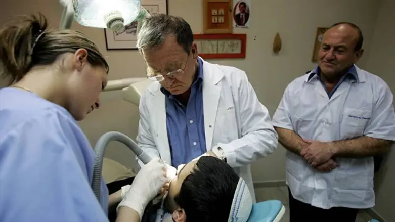 Dentists treat child