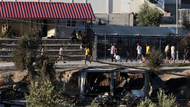 Debris of burned shelters at Moria refugee camp on the island of Lesbos