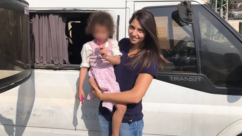 Plainclothes officer with rescued girl