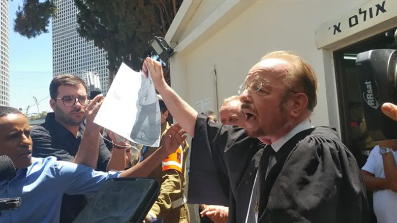 Sheftel displaying photograph