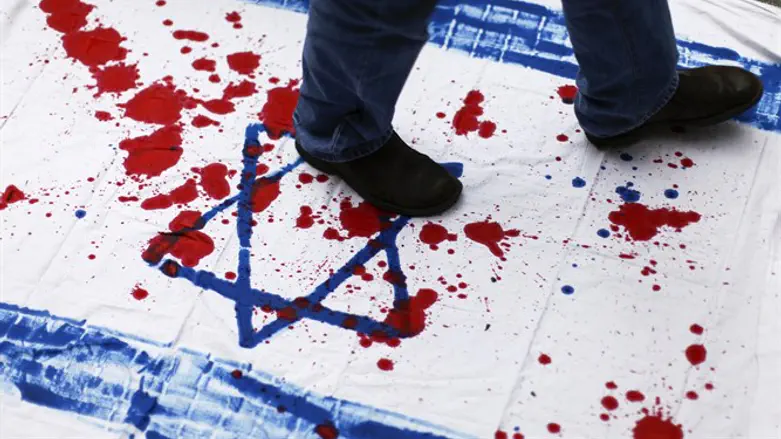 Venezuelan student tramples bloody Israeli flag during anti-Israel demonstration in Caraca