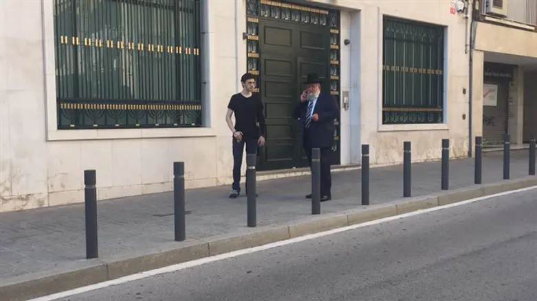 Rabbi Bar Chen at entrance to Jewish institution