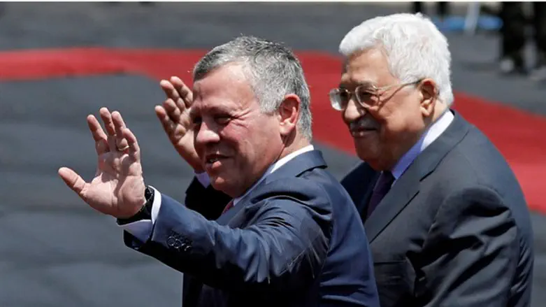 The King and I: Jordan's King Abdullah II and PA President Mahmoud Abbas wave to cameras