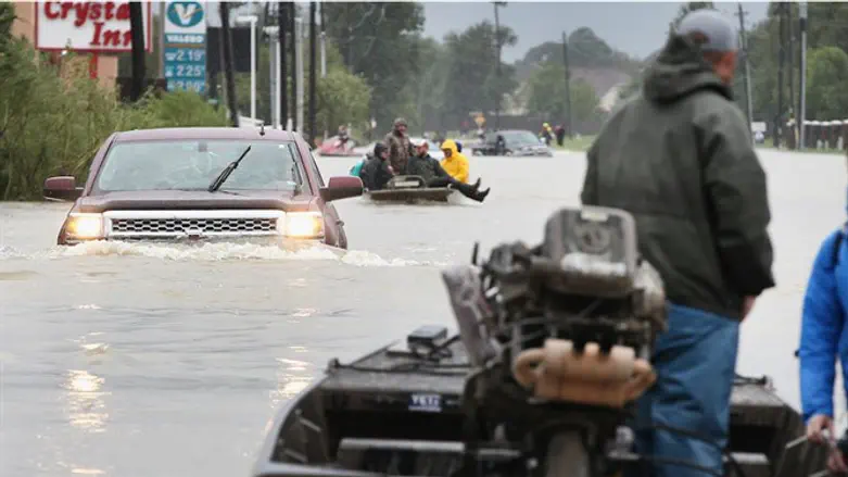 Rescue workers and volunteers help Houston's Harvey victims