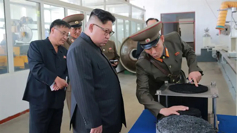 North Korean leader Kim Jong-Un looks on during visit to Chemical Material Institute of th