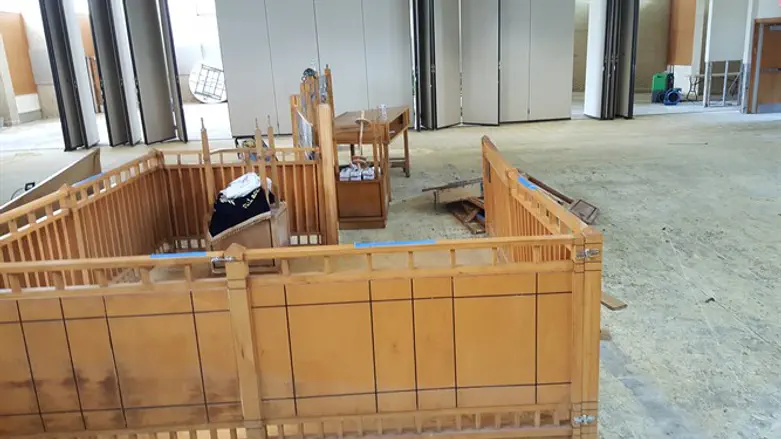 A room in United Orthodox Synagogues of Houston, stripped of its furniture and floors.