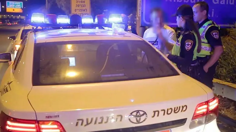 Traffic police testing a driver for alcohol in his breath