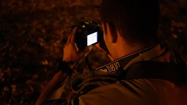 soldier with camera in the field