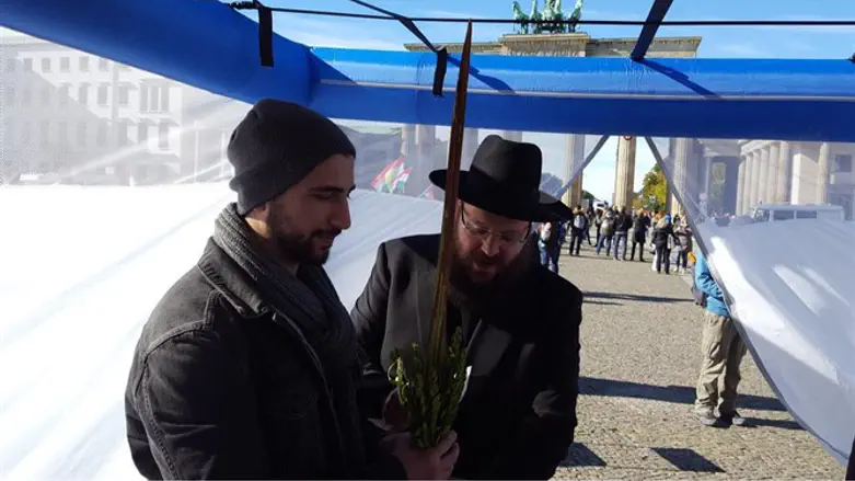 Rabbi Teichtal in his sukkah opposite Brandenburg Gate