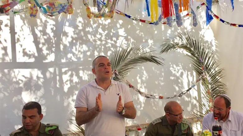 Oded Revivi speaks to Israelis and Palestinian Arabs in his sukkah