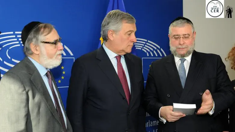 Rabbi Goldschmidt holding new book