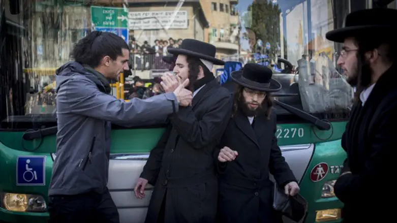 Secular Israeli confronts haredi demonstrators