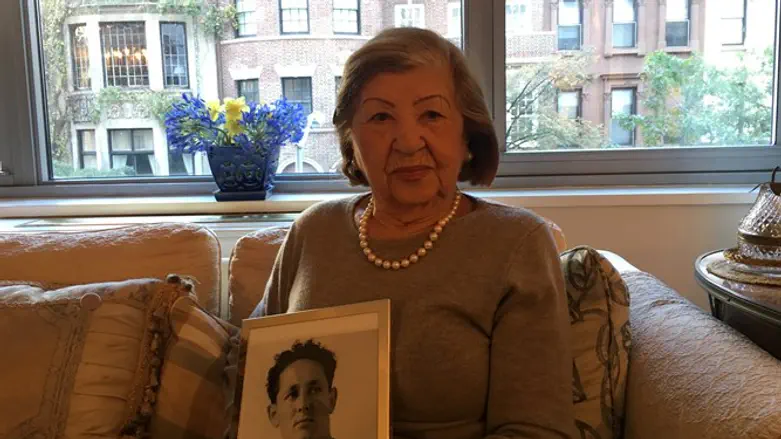 Rose Holm at her apartment holding a photo of her late husband, Joe