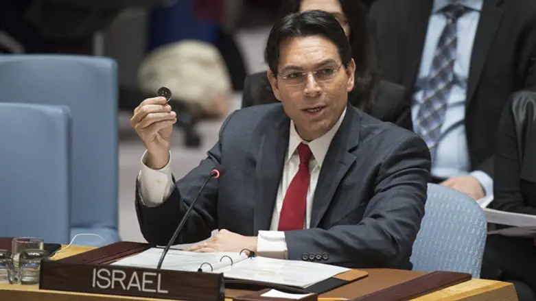 Danny Danon holds replica of Second Temple coin