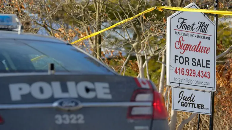 Police vehicle outside the home of Barry and Honey Sherman