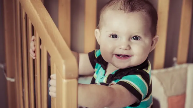 Baby in crib (illustrative)