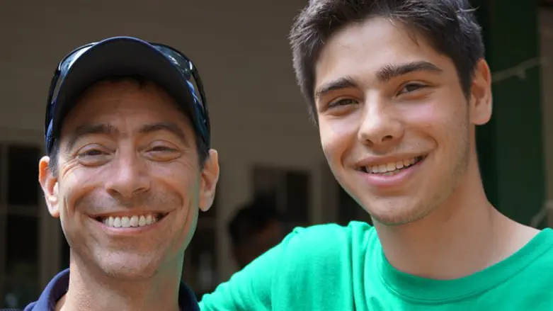 Bruce Steinberg, left, with son William at the Seeds of Peace Camp in Otisfield, Maine.