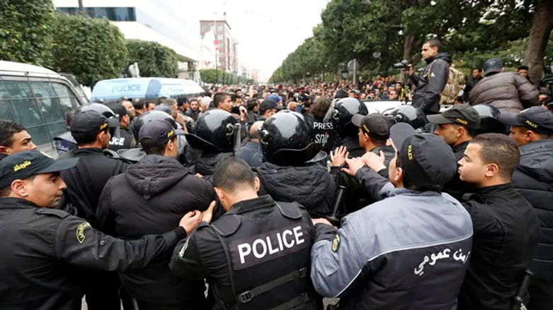 Tunisian protesters clash with riot police during demonstrations